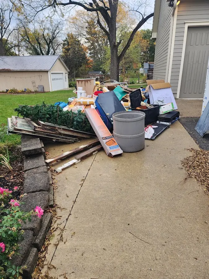 Dumpster being loaded with debris for 30 Yard Dumpster Rental in Cobleskill